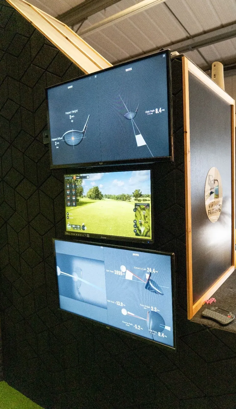Friends enjoying their first visit to a Virtual Fairways simulator bay in Darlington
